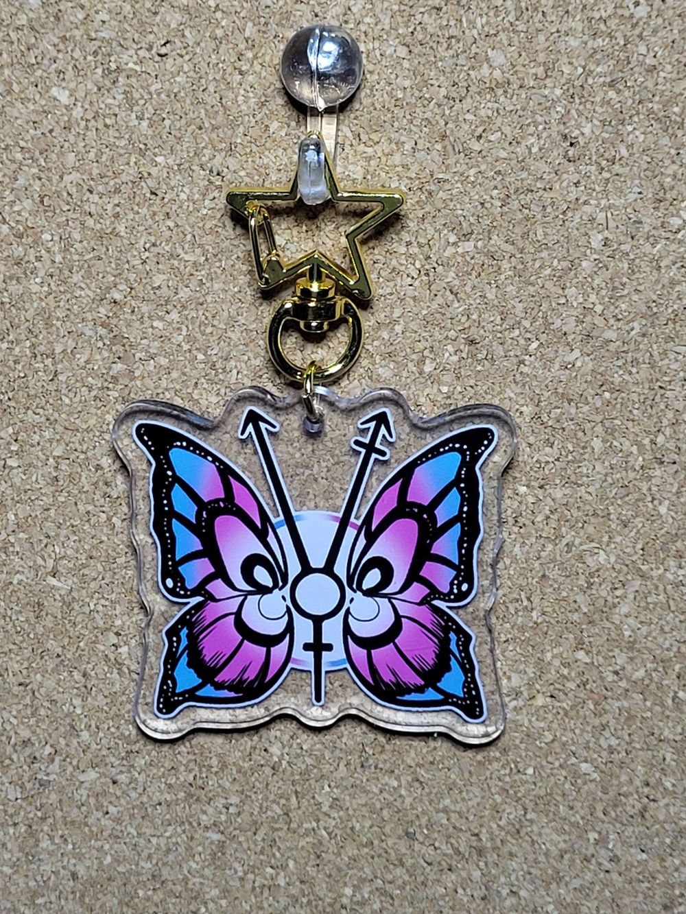 But-trans-fly charm